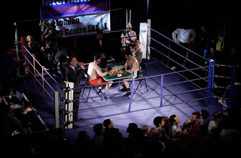 LONDON, ENGLAND - MARCH 10: Crowds watch a bout of chessboxing at the Scala nightclub on March 10, 2012 in London, England. A new hybrid sport combining chess and boxing in alternate 3 minute rounds, the winner is the one who knocks out or checkmates their opponent first. (Photo by Matthew Lloyd/Getty Images)